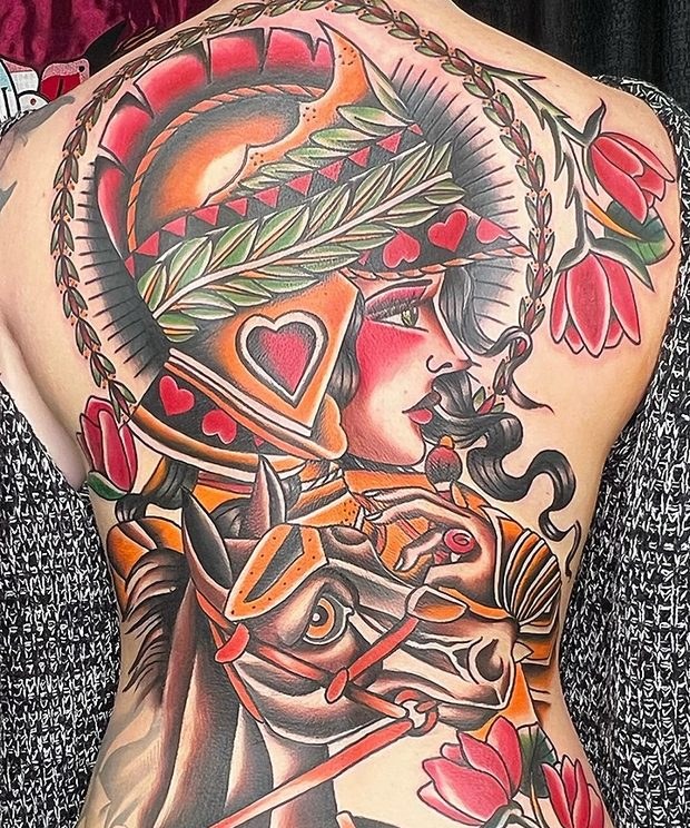 Full back tattoo of a warrior woman on horseback by Penny Boy — neo-traditional colour back piece